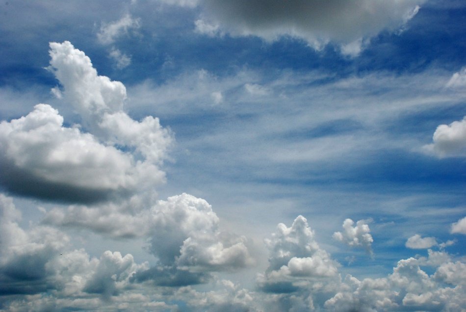 photo of cumulus clouds in a bright sky