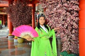 oriental girl in a green dress