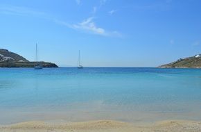 Mediterranean sandy sea beach with blue water in Greece