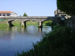 distant view of a stone bridge over a river