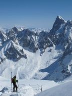 skier on a snowy mountain peak