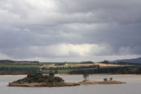 Landscape with the beautiful lake under cloudy sky in South Africa