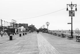 Black and white photo of boardwalk on a Coney Island