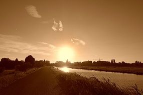 sunset over houses in holland