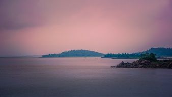 pink ocean against a pink sky