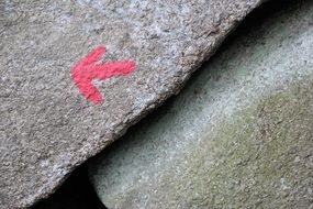 red arrow on a rock