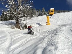 cyclist on a mountain ski slope