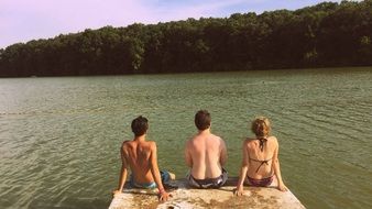 people sit near a lake in slovakia