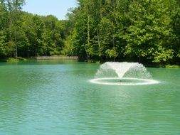 fountain among the pond in the park