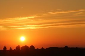 bright sun in the orange evening sky