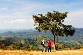 photo of tourists on the background of the mountains of Kalaw, Myanmar