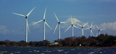 wind turbines over a lake