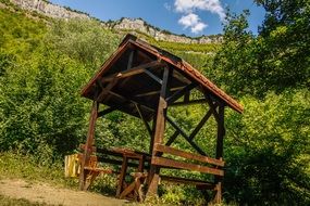 wooden gazebo in the forest foothills