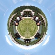 green islet with people on the water