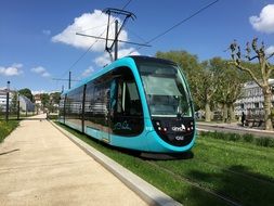 new blue Tram on railway in city in france, besancon