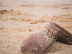 broken jug on a sandy beach