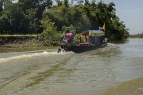 men in motor Boat on River, Bangladesh