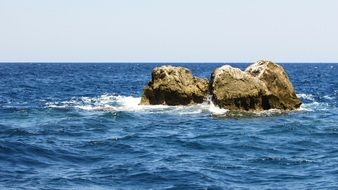 rocks in the sea in greece