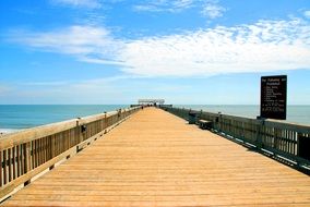 wooden fishing pier on a sunny day