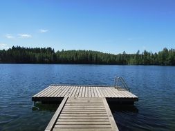 wooden pier with stairs to the lake