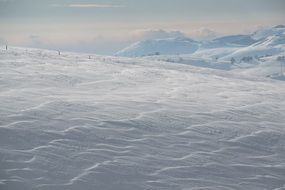 Beautiful winter landscape on a fields near the mountains