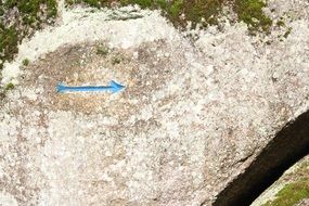 blue arrow on the stone