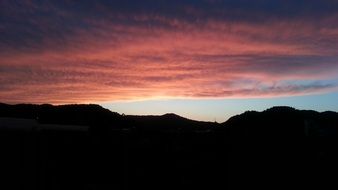 Beautiful and colorful, flaming sunset above the mountains on landscape