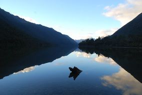 sky is reflected in Clear Tranquility Lake