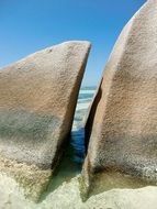 passage between large stones on the beach