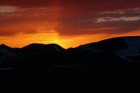 Beautiful sunny post at colorful sunset over the mountains