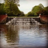 water cascade at pond in bushy park, uk, england, london