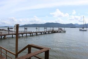boats on the calm water on the pier