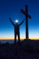 man on top of an alpine mountain
