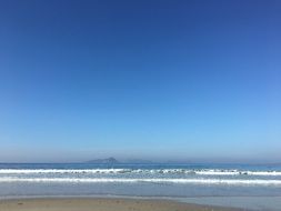 beautiful blue sky above distant islands with hills in ocean, view from Beach Ria De Vigo, Spain, Galicia, CÃ­es islands