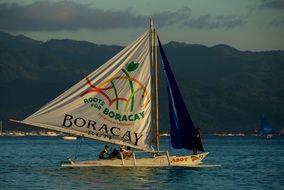 sailboat on the water off the coast of the Philippines