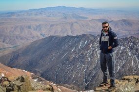 male Traveler Hiking in Mountain scene