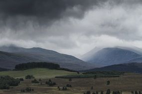 storm clouds over the mountains of scotland