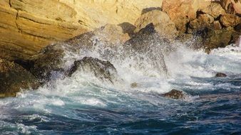 the wave beats on the rocks in cyprus