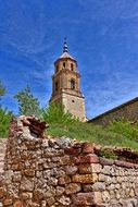 distant view of a church on a hill in albarracin