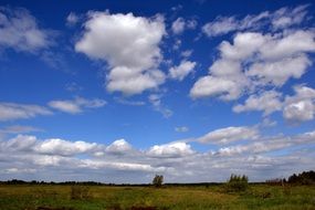 white clouds over rural landscape
