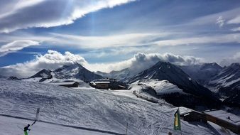 skiing traces on Mountain side in scenic Alpine landscape