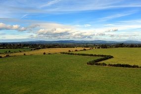 panorama of green meadows in Ireland