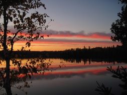 red Sunset with water reflections scene