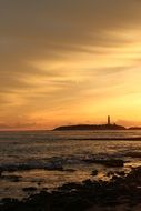 lighthouse far on the horizon
