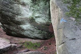 blue arrow on the rocks as a sign