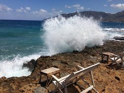 landscape of strong waves breaking on the rocky beach