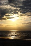 yellow evening sky over the north sea coast in the netherlands