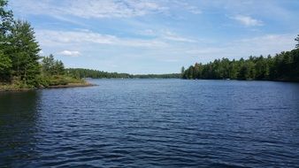 blue Lake with green forested shore, canada
