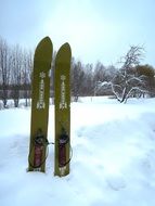 green skis in deep snow