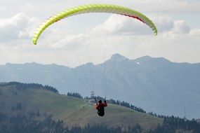 paraglider in the alpine sky